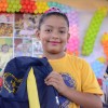 Natal,RN - Com lindo sorriso no rosto, crianças demonstram a alegria ao receber a mochila com o kit completo de material pedagógico.