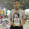 Assim que chegou na 17ª Bienal Internacional do Livro, Alexandre Lopes de Souza foi adquir o seu exemplar de Jesus, a Dor e a origem de Sua Autoridade - O Poder do Cristo em nós, do escritor Paiva Netto. 