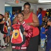 Mother and son from the YMCA Shelter of Newark with their new backpack from the Backpacks for a Bright Future campaign