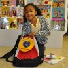 7-year-old Vitória excited to see what's inside her new backpack from the LGW