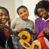 Students from the Orange, New Jersey recieve new backpacks filled with school supplies from the Backpacks for a Bright Future campaign.