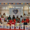 Student volunteers and the LGW staff with the care packages they prepared for the Everlasting Christmas campaign event.