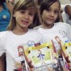 CAMPO GRANDE, MS — Crianças exibem alegremente o livro A Vida de Jesus, do selo Soldadinhos de Deus, dentro das comemorações do 13º Fórum. 