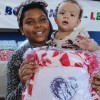 Ceilândia, DF - A caravana da Boa Vontade marcou presença na comunidade Sol Nascente para entregar cobertores arrecadados por meio da campanha Diga Sim!, da LBV, às famílias atendidas pela organização Obras Sociais Grupo Espírita Fraternidade Irmã Celina.