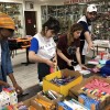 LGW and WHAO volunteers assemble school supplies kits for children in need.
