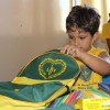 Taguatinga, DF — Criança atendida pela Legião da Boa Vontade confere os materiais escolares que ganhou da Instituição.