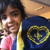 Francisco Badaró, MG — Sabe qual é o motivo da satisfação desta menina tão linda? É que ela recebeu hoje, da Legião da Boa Vontade, esta mochila cheinha de material pedagógico!