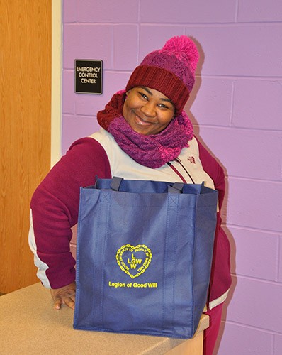 Parent of Oliver St. School in Newark, NJ happily receives food basket from LGW's Everlasting Christmas campaign